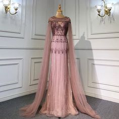 Gilded Grace: Champagne Beaded Mermaid Gown with Arabic-Inspired Cape Sleeves 2024 Arabic Aesthetic, Beaded Mermaid, Custom Bridesmaid Dress, Pregnant Wedding Dress, Bridal Elegance, Evening Dresses With Sleeves, Gold Luxury, Cape Sleeves, Custom Wedding Dress