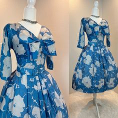 "Suzy Perrette dress / 1950s dress / 50s dress / 1950s fit and flare dress This 1950s Suzy Perette dress is made from a soft silk and has a gorgeous floral print. I love her floral print and how the fabric looks it's hard to tell if it is white flowers on blue or blue flowers on white. It is truly a magical print . She has the classic fit and flare cut with the nipped waist, a full skirt, and her original wide belt. She has a metal zipper in the back. Measurements provided are flat and have been Vintage Fitted A-line Tea Length Dress, 1950s Style A-line Midi Dress For Formal Occasions, Vintage Silk Midi Dress For Evening, Vintage Tea-length Midi Dress With Fitted Bodice, Party Dress With Box Pleat And Full Skirt, 1950s Style A-line Dress With Box Pleat, 1950s Style A-line Vintage Dress For Events, Vintage A-line Tea Length Dress, 1950s Style Dress With Fitted Bodice For Vintage Events