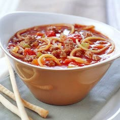 a bowl of soup with noodles and meat