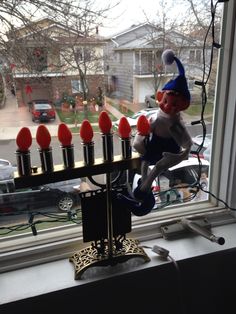 a hanukkah menorah sitting on top of a window sill