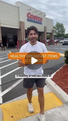 a man standing in front of a costco store with the words healthy breakfast items at c co