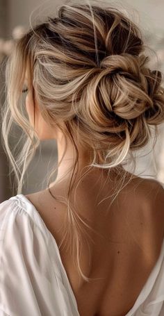 Transform your long locks with 27 stunning messy bun ideas that blend casual charm and elegance. These chic updos offer endless possibilities for both relaxed and formal settings. From textured high buns to relaxed low styles, find the ideal messy bun to showcase your long hair. Embrace these trendy, low-maintenance hairstyles that exude effortless beauty and sophistication. Wedding Messy Updos For Long Hair, Bridesmaid Low Messy Bun, Messy Formal Hair, Bridal Bun Messy, Up Dos Bridesmaids, Loose Up Do Wedding Hair, Bride Messy Updo Hairstyles, Messy Updo Fine Hair, Formal Hair Updos For Long Hair