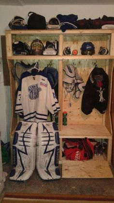 the inside of a hockey locker filled with sports gear