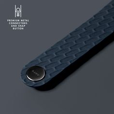 a close up of a blue object on a gray surface with the words premium metal products and shape button