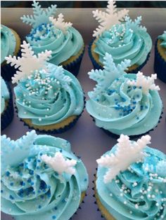 blue frosted cupcakes with snowflakes on them