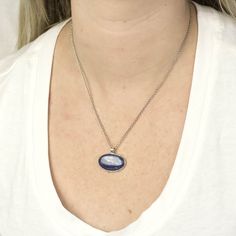 A rich blue stone with natural color banding and depth, this blue beauty will compliment any look. Kyanite is one of the few minerals that never need cleansing or clearing, as it does not retain any negative energy or vibrations. Wearing this gemstone aligns all chakras, bringing you tranquility and a calming effect to one's whole being. It is the perfect stone to facilitate meditation. Stone Origin: BrazilPlease Note: All pieces shipped within 48 hours from our Del Mar Gallery Measures Approxim Sterling Silver Oval Necklace For Everyday, Everyday Oval Necklace With Polished Finish, Everyday Silver Oval Necklace, Silver Oval Necklace For Everyday, Natural Stones Necklace With Oval Cabochon, Oval Gemstone Necklace For Everyday, Silver Necklace With Large Oval Pendant, Silver Necklace With Large Oval Cabochon Stone, Sterling Silver Necklace With Large Oval Stone