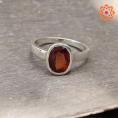 "Silver Oval Shape Garnet Ring astrology purpose for men's and women's Metal : 925 Sterling silver Stone : Natural Hessonite Garnet (Gomed) Size : 4 to 11 Ct. Shape : Oval Cutstone Gomed (Hessonite Garnet) is all the name of same stone which is the stone for Rahu. Gomed (Hessonite Garnet) is the gemstone for Rahu and by wearing Gomed (Hessonite Garnet) stone one gets relief from the atrocities of Rahu which it does on the native if it is not beneficially placed in horoscope. The Gomed (Hessonite Garnet) brings peace and happiness in life. By wearing it you could be able to neglect all the bad and negative impacts of the Rahu and your enemy's bad vision upon you. The Gomed (Hessonite Garnet) stone is very beneficial for people pursuing public speaking as its wearer influence over large crow Oval Spiritual Ring With Polished Finish, Oval Spiritual Rings With Polished Finish, Oval Sterling Silver Rings With Si Clarity, Oval Sterling Silver Ring With Si Clarity, Classic Oval Rings With Si Clarity, Modern Silver Ruby Ring With Oval Shape, Silver Oval Ruby Ring Spiritual Style, Sterling Silver Ruby Ring With Polished Finish, Oval Ruby Ring With Polished Finish In Sterling Silver