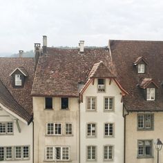 an image of a calendar with houses in the back ground and windows on each side