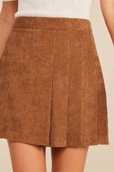 Keep it classic in the Callie Corduroy Mini Skirt! Soft and trendy corduroy shapes this high-waisted skirt with a flattering A-line silhouette and front pleats. Pair with a long sleeve top and boots for a fall-approved look! Mini Skirt Color: Camel Fit: True to size High-waisted Front pleats Hidden zipper closure A-line Model is wearing a size Small Corduroy Mini Skirt Outfit, Homecoming 2024, Camel Skirts, Corduroy Top, Mini Skirt Style, Skirt Outfits Fall, Corduroy Mini Skirt, Free Spirit Style, Chic Skirts