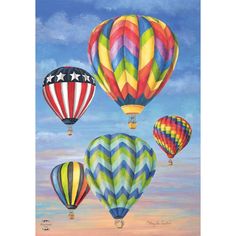 three hot air balloons flying in the sky with stars and stripes on them, one is multicolored