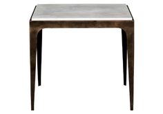 a metal table with a white marble top