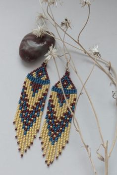 Long fringed western-wear earrings provide lots of movement and style. 4" long, 1" wide. Nickel-free ear wires.   To see more designs you might like, click on my shop name at the top of the page. Thanx to Mani on YouTube for this idea. Southwestern Beaded Earrings With Tassels For Festival, Southwestern Beaded Fringe Earrings, Western Beaded Earrings, Fringe Beaded Earrings, Beaded Hat Bands, Earrings Patterns, Native American Earrings, Bead Ideas, Long Fringe