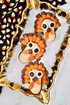 two turkey cookies with googly eyes on them and the words, turkey cookies for your thanksgiving