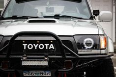 the front end of a silver toyota truck