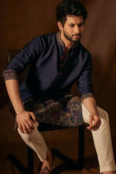 Elevate your style for any festive gathering with this striking navy blue men's kurta pajama ensemble. Crafted from silk fabric, it boasts intricate resham thread and sequins work that enhances its timeless charm. The collar and full sleeves offer a stylish touch, while the bottom made of silk fabric completes the look. This kurta pajama can be customized up to 68 inches. Kurta Designs Men's, Men's Kurta Pajama, Velvet Suit Design, Wedding Kurta For Men, Kurta Pajama Men, Short Instagram Captions, Kurta Men, Men's Kurta, Mens Photoshoot Poses