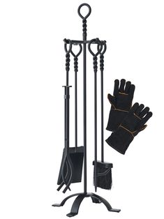 a pair of gloves and an oven mitt on top of a black stand with two poles