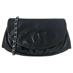 Chanel Black Caviar Leather Half Moon Wallet On Chain WOC Crossbody Bag. Chain can be tucked inside bag to also be worn as a clutch. Made In: Italy Year of Production: 2012 Color: Black Hardware: Silvertone Materials: Caviar leather Lining: Black leather and textile Closure/Opening: Flap top with magnetic closure Exterior Pockets: None Interior Pockets: Zipper pocket, six credit card slots, two flat pockets Exterior Condition: Excellent Interior Condition: Excellent Includes: Chanel dustbag, aut Textured Leather Clutch Wallet For Evening, Evening Clutch Wallet With Removable Pouch, Evening Clutch Wallet On Chain With Removable Pouch, Compact Evening Bag With Removable Pouch, Chanel Crossbody Bag, Chanel Cross Body Bag Black, Black Crossbody Bag Chanel, Chanel Classic Wallet On Chain, Chanel Crossbody