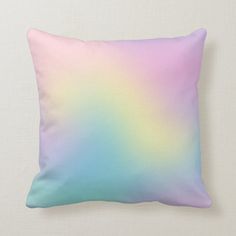 a pillow with a pastel colored ombreed design on the front and back