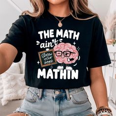 Celebrate your love for numbers with our "Math Teacher Shirt" and bring a smile with "The Math Ain't Mathin Shirt". Encourage your students with the "Show Your Work Math Teacher Tee" and add some humor to your wardrobe with the "Funny Math Teacher Shirt". Stay stylish and inspiring in our "Cute Math Teacher Shirt," perfect for every dedicated math educator! 🔢✨ Elevate your classroom style with our Math Teacher Shirt, perfect for showcasing your love for numbers and equations! 📚 🤔 Make your st Cute Math Teacher Shirts, Math Teacher Aesthetic, Math Tshirts, Math Teacher Humor, Show Your Work, Classroom Style, Teacher Fashion, Math Teacher Shirts, Math Shirts