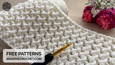 the crochet pattern is being used to make a knitted hat with flowers in the background