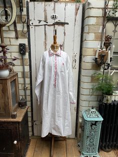 Antique French white cotton shirt nightshirt chemise with red trim size XL. 100% Cotton. Collar, button tab and cuffs with red trim detail, handgathering at back, side slits, monogram initials JB?. Size:  Chest: 54 inches; Shoulder to shoulder: 17 inches; Sleeve length: 24 inches; armhole width: 10 inches; Length: 50 inches (back). Weight: allow up to 1 kg once packed. Good condition for its age - one small black smudge at side but otherwise fine. Priced accordingly. White Cotton Shirt, Women's Nightgowns, Pajama Robe, Nightgowns, Night Shirt, Trim Detail, Monogram Initials, French Antiques, White Cotton