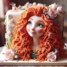 a close up of a cake with a doll on it's face and flowers in the hair