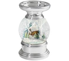 a snow globe with a house in it