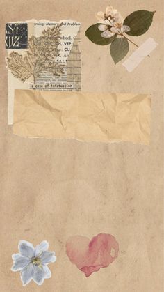 a piece of brown paper with flowers and leaves on it, next to a postcard