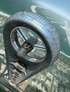 an aerial view of a futuristic building in the sky