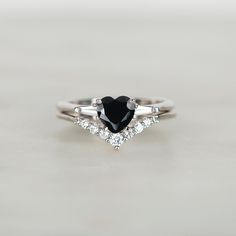 Black Heart Solitaire Ring ♦ Handmade, high-quality item (Made to order) ♦ Material:925 Sterling silver (can be made in Solid white/rose/yellow gold) ♦Finish:  High Polishing Finish with Rhodium platting ♦ Center stone: Black simulated diamond ♦ Size/Weight: Heart cut 6x6mm  ♦ Color: Black ♦ Side stones: Simulated Diamonds(7A grade super quality cubic zirconia) ♦ Size: Tapered baguette cut 4x2 ♦ Color: D ♦Clarity: VVS1 ♦Cut Grade: Excellent ♦ Width of band bottom - 2 mm ♦ Thickness of the gold b Dainty Black Wedding Ring, Black Heart Cut Jewelry For Wedding, Classic Heart Cut Stackable Rings As A Gift, Classic Heart Cut Stackable Rings For Gift, Classic Heart Cut Stackable Wedding Rings, Vintage Sterling Silver Heart Ring For Wedding, Sterling Silver Bridal Sets Gift, Elegant Black Heart Ring For Weddings, Elegant Heart Cut Stackable Wedding Rings