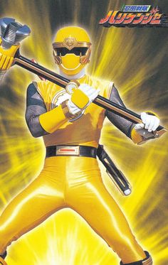 an image of a man in yellow and black costume holding two large metal hammers