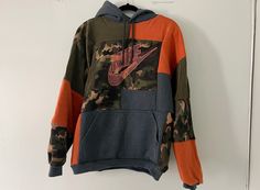 Nike Camo patchwork hoodie, up-cycled by me from recycled fabrics :)  Size : L Please note that all items are made from second hand fabrics so all pieces may not be perfect (ie: small stains or tears) https://loonypindesigns.etsy.com Urban Sweatshirt With Patchwork For Streetwear, Urban Patchwork Sweatshirt For Streetwear, Oversized Patchwork Hoodie For Streetwear, Patchwork Hoodie For Fall Streetwear, Casual Patchwork Sweatshirt For Streetwear, Fall Patchwork Hoodie For Streetwear, Urban Patchwork Sweatshirt, Fall Patchwork Sweatshirt For Streetwear, Athleisure Long Sleeve Patchwork Sweatshirt