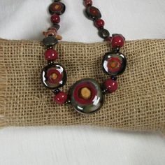 Honey Kazuri Bead Jewelry, Krobo Beads Necklace, Adjustable Multi-strand Fair Trade Beaded Necklaces, Artisan Brown Carnelian Beaded Necklace, Multi-strand Red Necklace With Wooden Beads, Multi-strand Red Necklace With Colorful Beads, Kazuri Beads, Beaded Bangles Bracelets, Big Necklace