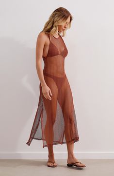 This stunning cover-up dress is completely sheer to show off what's underneath as you lounge by the water feeling your most confident. 43" length ( size Medium) Slips on over head Jewel neck Sleeveless Sheer 58% polyamide, 32% polyester, 10% elastane Hand wash, dry flat Made in Brazil Hispanic & Latinx Owned/Founded Fitted Sheer Maxi Dress For The Beach, Sheer Mesh Maxi Dress For Beach, Sleeveless Mesh Dresses For Beach Season, Spring Beach Mesh Maxi Dress, Mesh Swimwear Beach Cover-up For Beach Season, Sheer Sleeveless Beach Dress For Beach Season, Mesh Maxi Dress For Beach, Sheer Sleeveless Maxi Dress For Beach, Sleeveless Sheer Maxi Dress For Beach