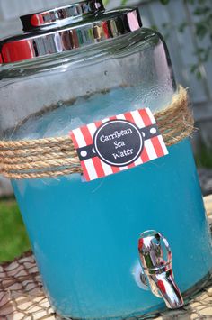 a blue jar sitting on top of a table