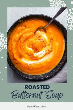 roasted butternut soup in a black bowl with a spoon and snowflakes behind it