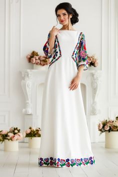 Festival Maxi Dress With Embroidered Border, Festive Embroidered Maxi Dress With Multicolor Embroidery, Festive Maxi Dress With Multicolor Embroidery, Elegant Embroidered Neckline Dress For Festivals, White Embroidered Maxi Gown, White Embroidered Maxi Length Gown, Festive Traditional Maxi Dress With Embroidered Neckline, White Floral Embroidered Maxi Gown, Festive Maxi Dress With Intricate Embroidery