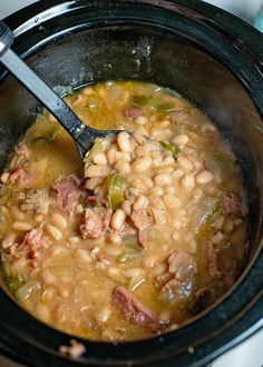 a close up of a bowl of food with a spoon in it