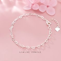 Our Simple and Cute Heart Chain Bracelet are the perfect addition to your minimalist jewelry collection. These Heart Link Bracelet are created in 925 sterling silver and are great for everyday wear and perfect gift for birthday, anniversary, bridesmaids, graduation, friendship, sisters. Hypo-allergenic, lightweight and minimalist. ♡ Product Details * Chain size: Adjustable chain: 16 cm with 3 cm extender, in total it measures 18 cm. * Chain thickness: 0,5 mm * Chain width: 25 mm * Bracelet Weigh Elegant Hypoallergenic Chain Bracelet For Valentine's Day, Heart Shaped Silver Chain Bracelet For Gift, Elegant Sterling Silver Double Heart Charm Bracelet, Minimalist Silver Chain Heart Jewelry, Minimalist Silver Bracelet With Heart Charm, Minimalist Adjustable Chain Bracelet For Valentine's Day, Silver Chain Bracelet With Adjustable Chain For Valentine's Day, Sterling Silver Bracelets With Adjustable Chain For Valentine's Day, Sterling Silver Adjustable Bracelets For Valentine's Day