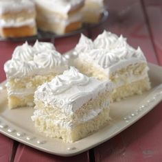 three pieces of white cake on a plate