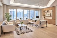 a living room filled with furniture next to a window covered in lots of glass windows