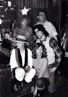 black and white photograph of people wearing hats