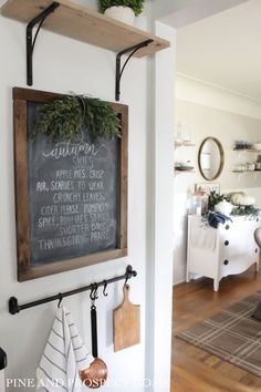 a chalkboard hanging on the wall in a kitchen