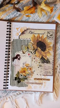 an open notebook with sunflowers on it