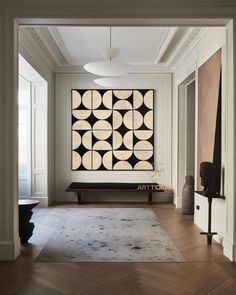 an artful living room with white walls and wood floors