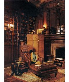 a living room filled with furniture and a fire place in the middle of a room