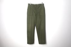 Vintage men's 1970s 80s U.S. military pants Waist - 34 inches Inseam - 32 inches Rise - 12 inches Hips - 44 inches Cotton/Poly blend Great condition ez70 Military Style Green Cargo Pants For Workwear, Green Military Work Pants With Cargo Pockets, Vintage Green Cotton Work Pants, Military Style Workwear Pants, Military Style Khaki Work Pants With Belt Loops, Khaki Military Work Pants With Belt Loops, Military Pants, Cargo Style, Vintage Military