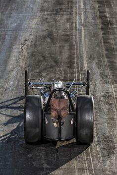 a person riding on the back of a race car