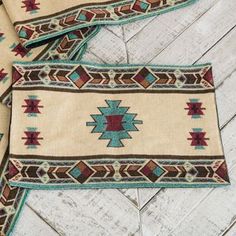 three southwestern rugs are laying on the floor