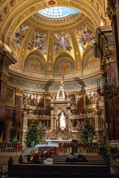 the inside of a church with decorated pews